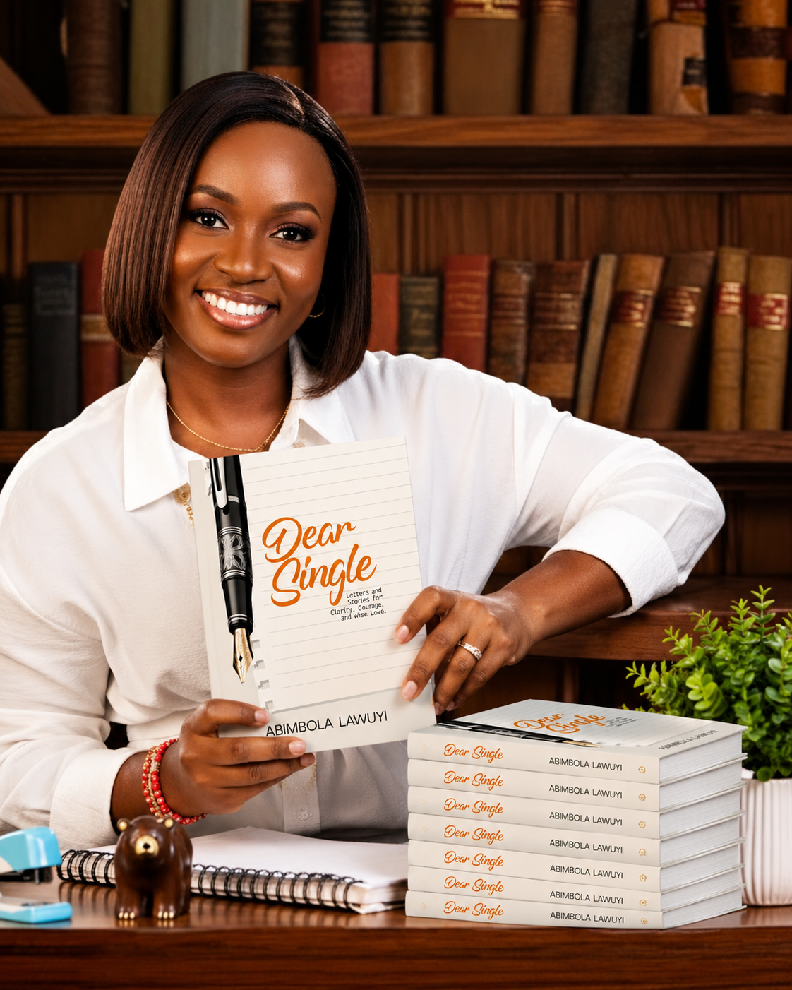 Abimbola Lawuyi holding her book