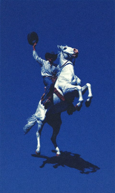 A cowboy riding a rearing horse against a blue background.