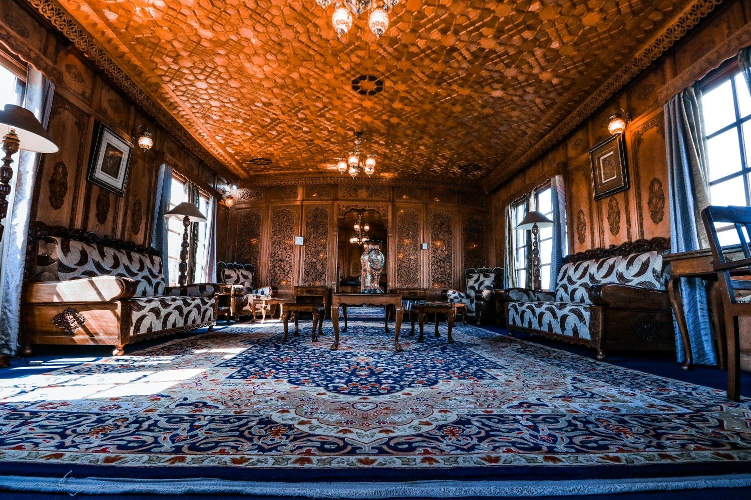 Luxury classical living room with ornate ceiling and elegant furniture