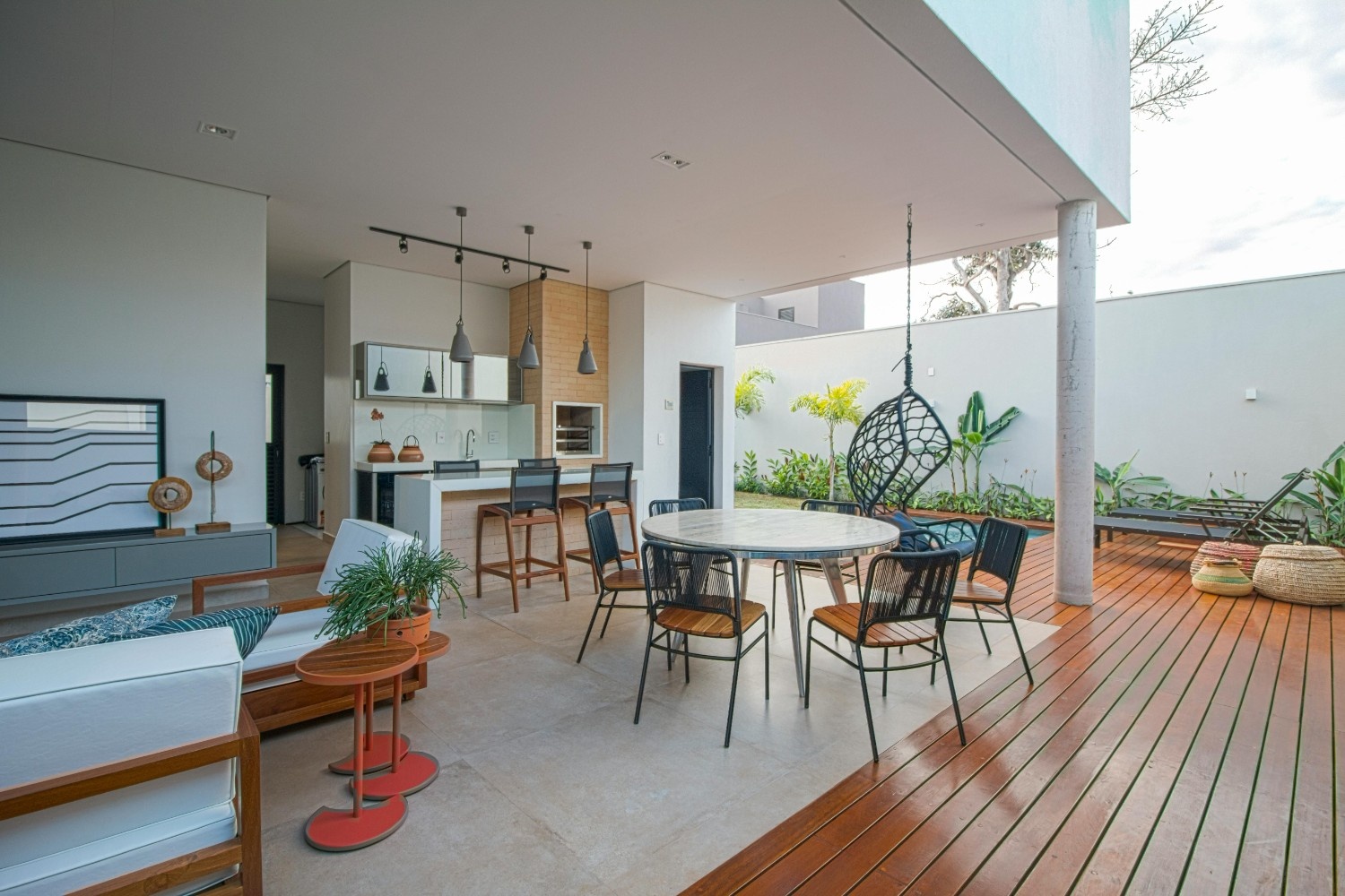 Modern interior design featuring contemporary furniture, plants, and elegant styling