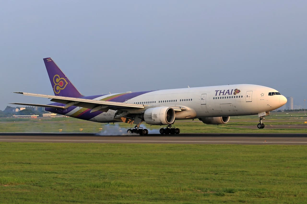 an airplane taking off to thailand