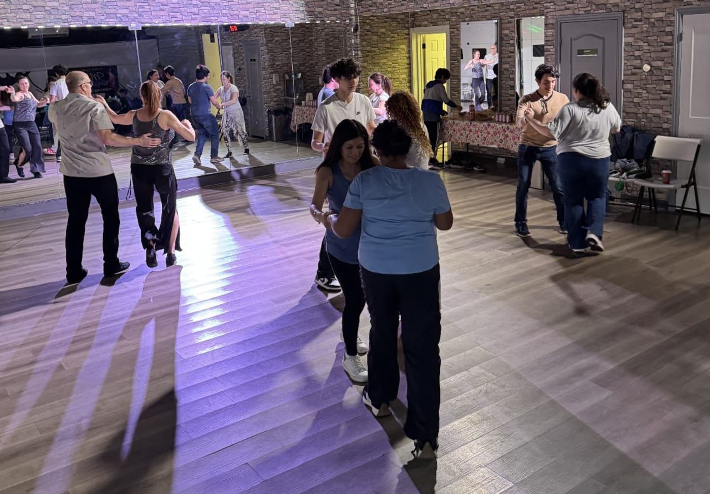 Couples and singles dancing Latin at Mayada's Dance & Fitness