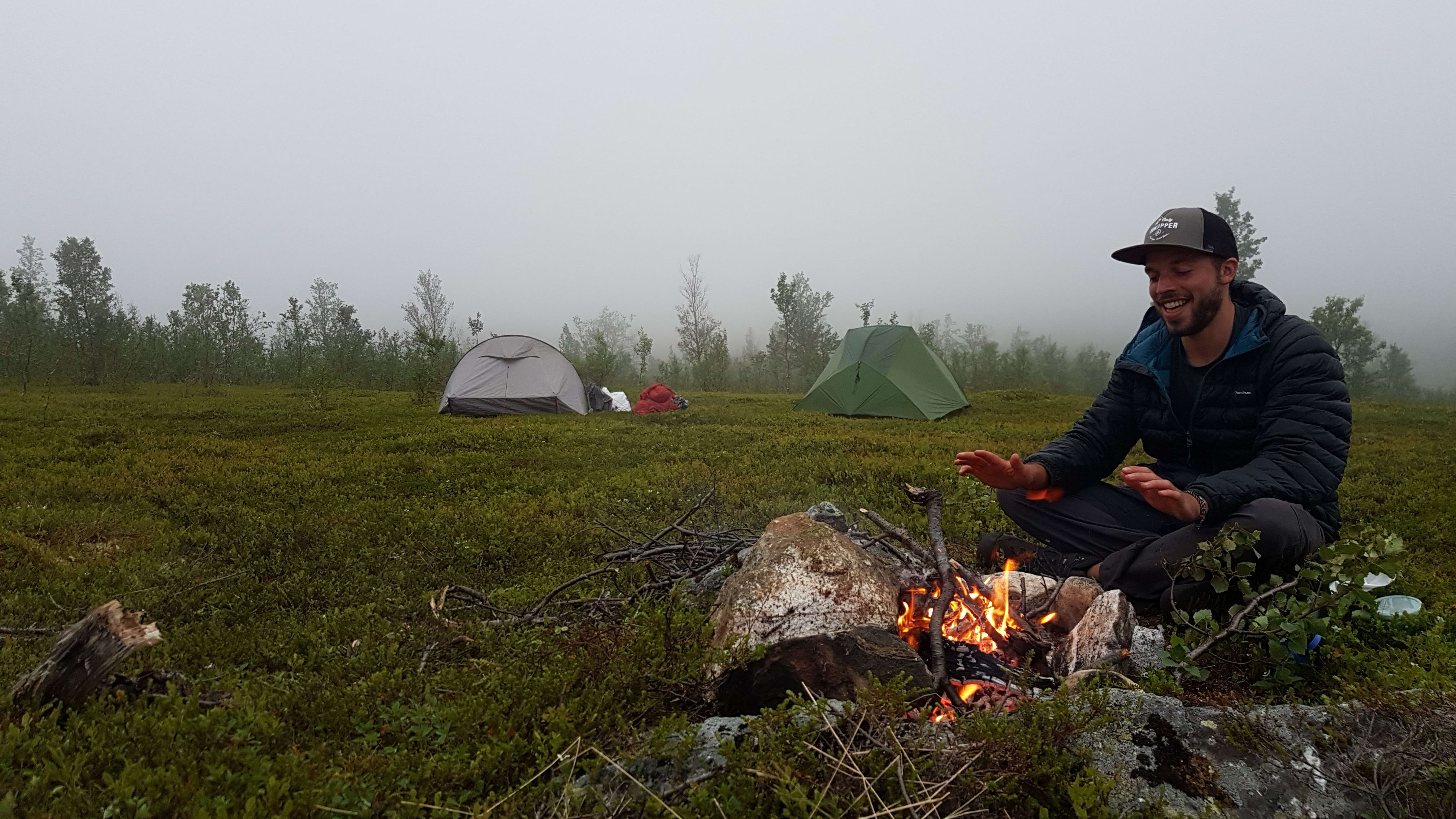 Xavier de Beauffort, yoga teacher and retreat guide by campfire in Norway