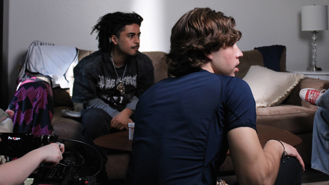 A small group of people sitting in a living room