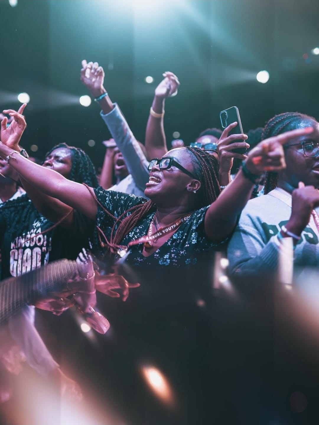 Crowd with hands raised at YAF USA praise night
