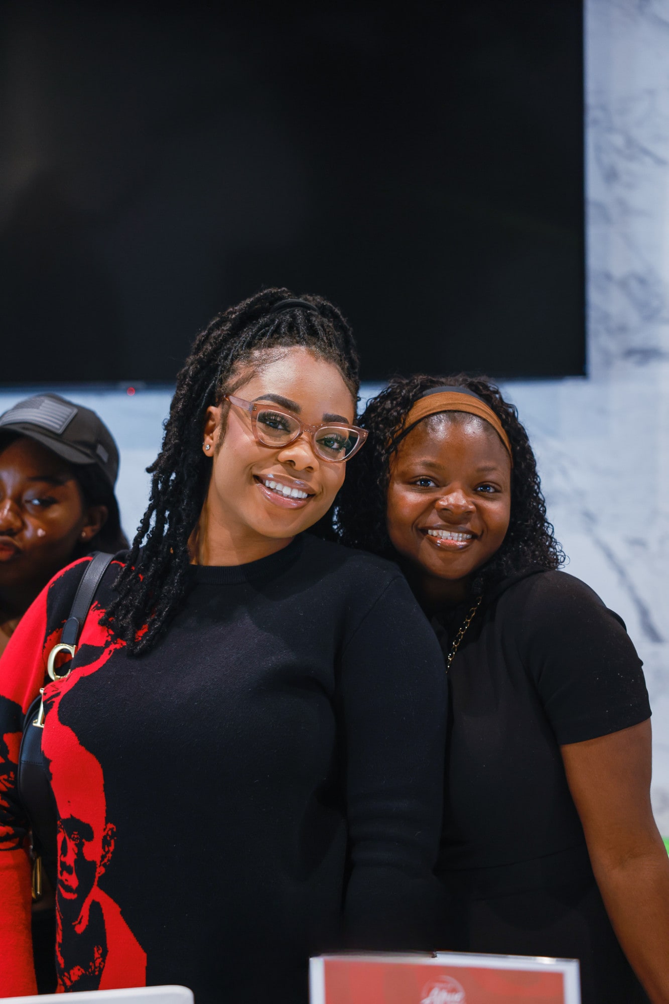 Two young women smiling at YAF USA