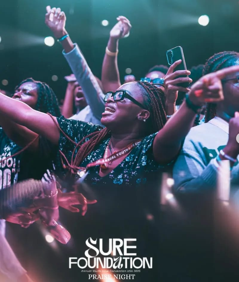 Crowd worshipping with phones up