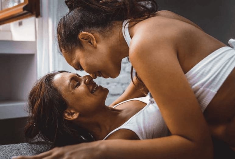 woman on top of another woman