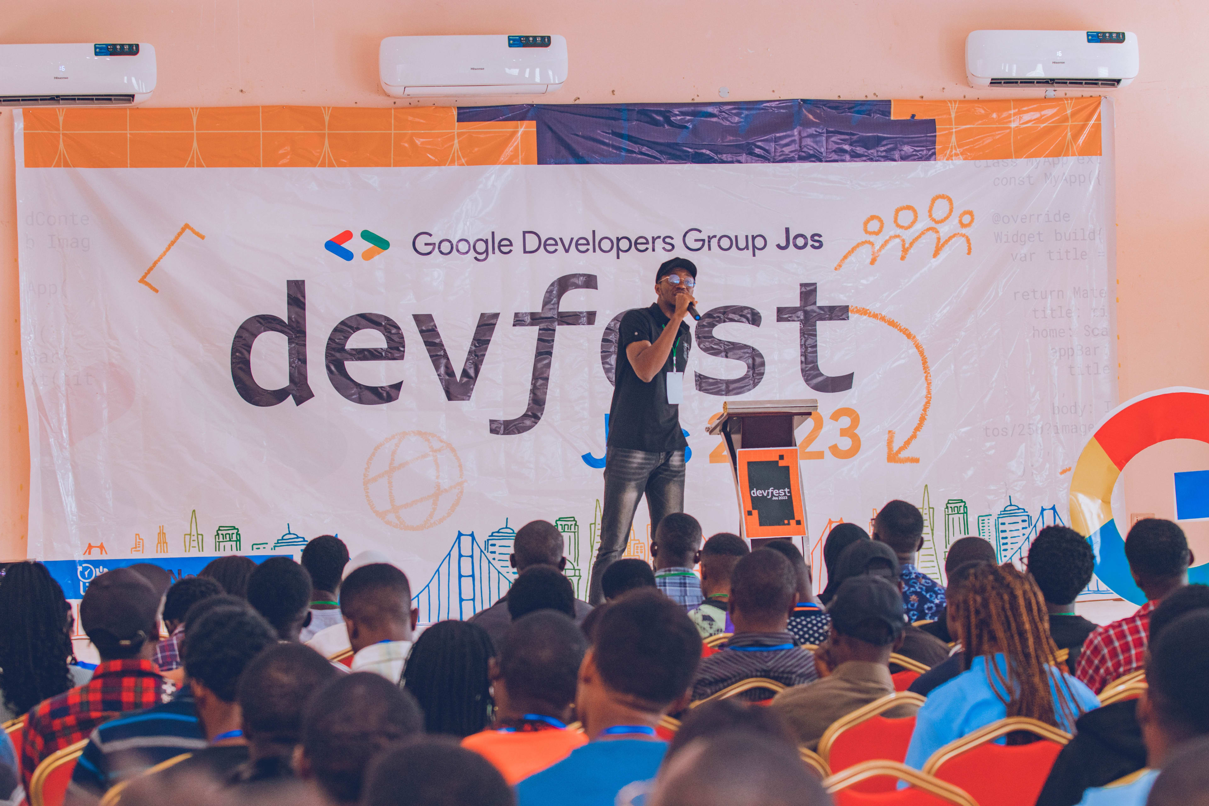 A packed hall listening to a talk at DevFest Jos