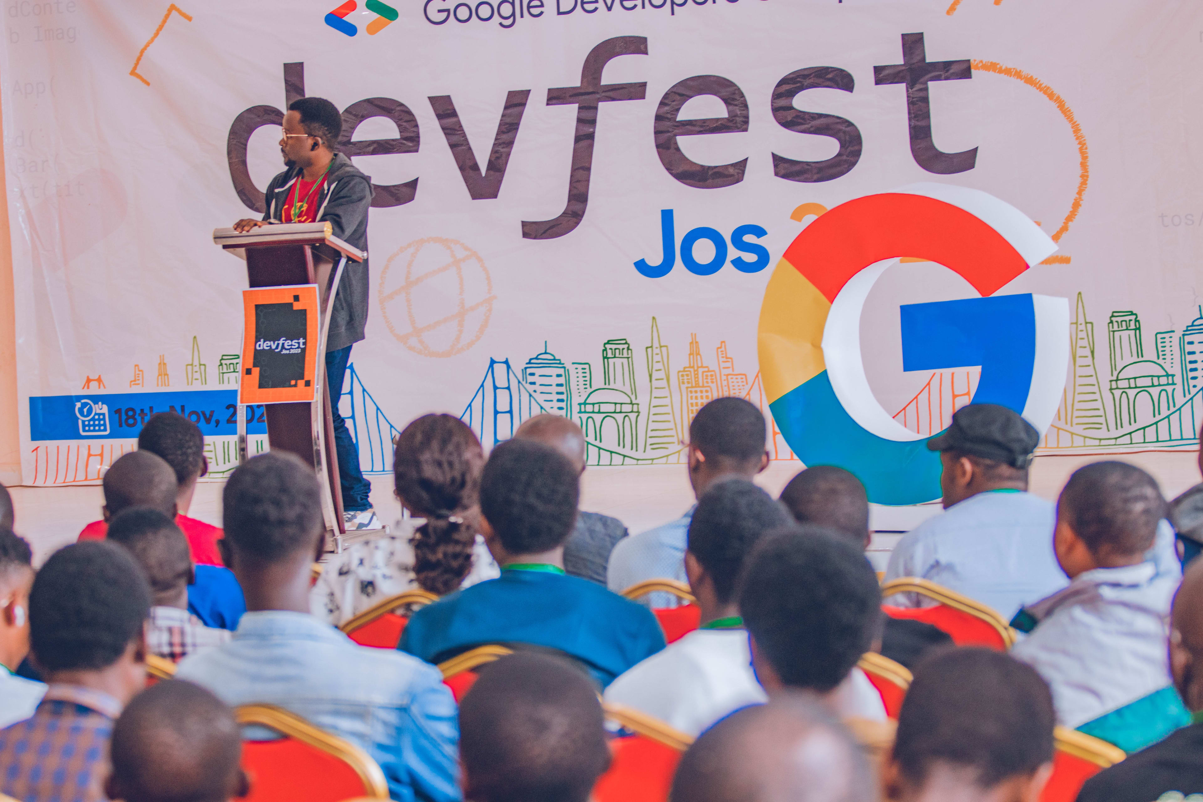 A speaker on stage at DevFest Jos