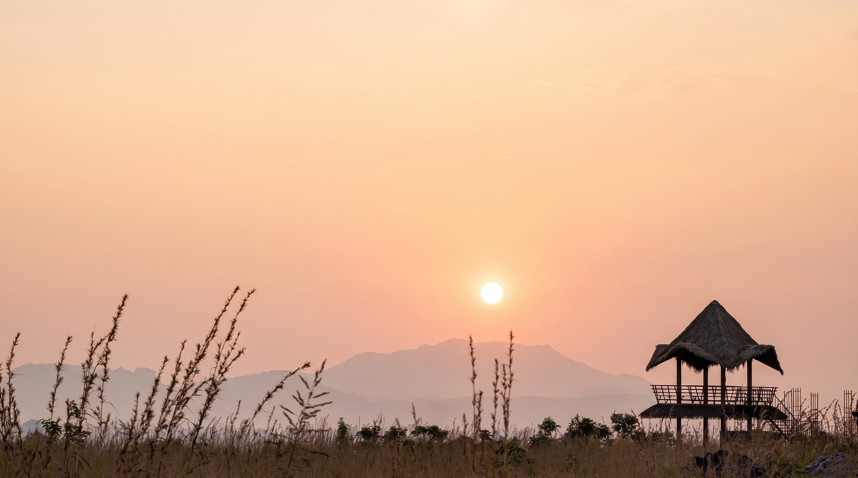 Sambrahma rolling farmland with forest views