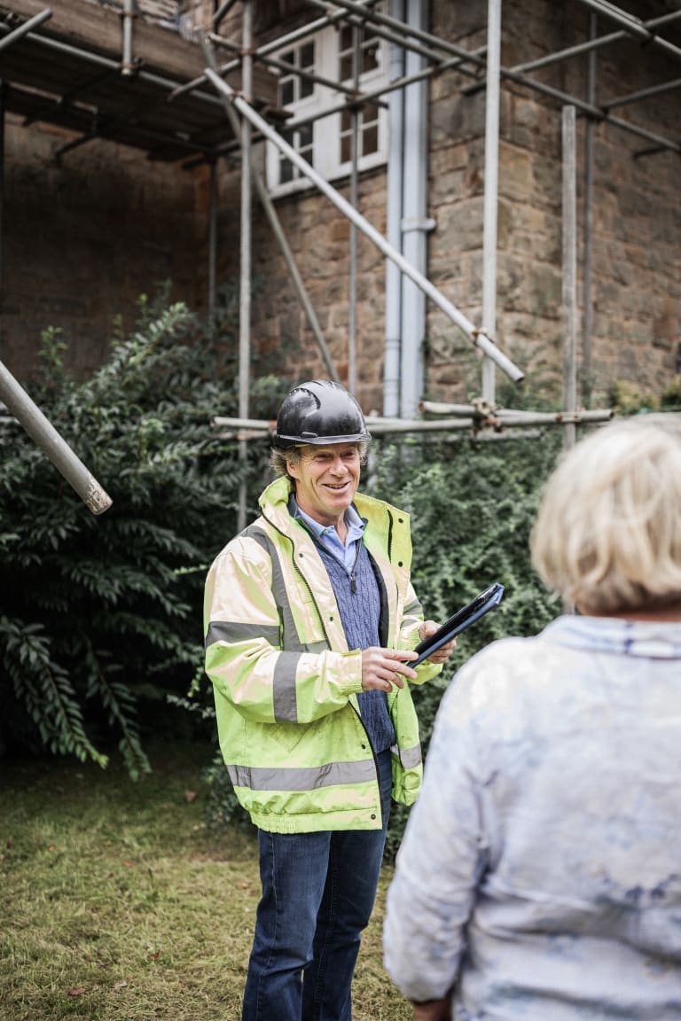 Kitchen project manager guiding a client through available options