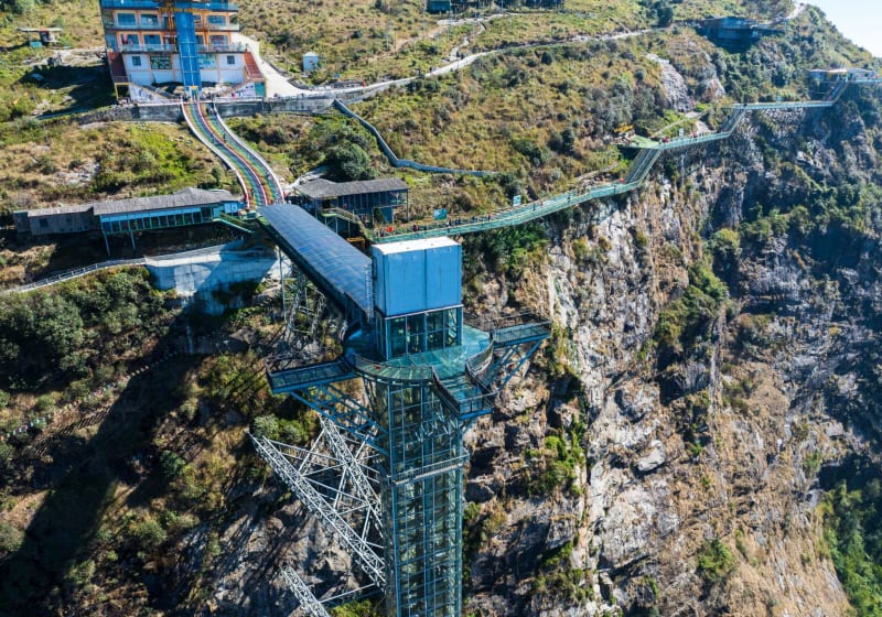 The Rong May glass bridge reaching out from the cliff, from above