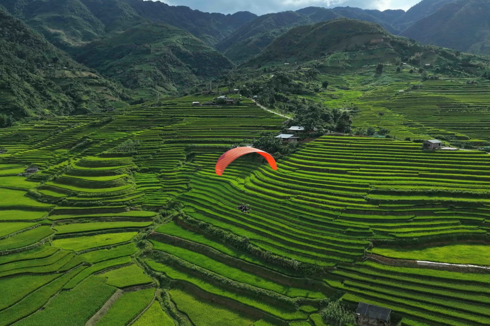 Passengers are surrounded by lush green rice terraces while flying here