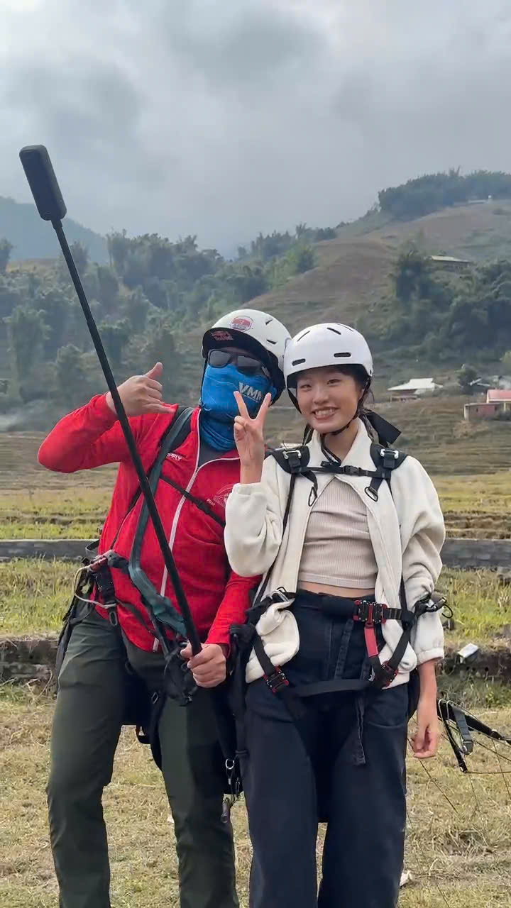 Pilot and passenger posing for a photo after landing