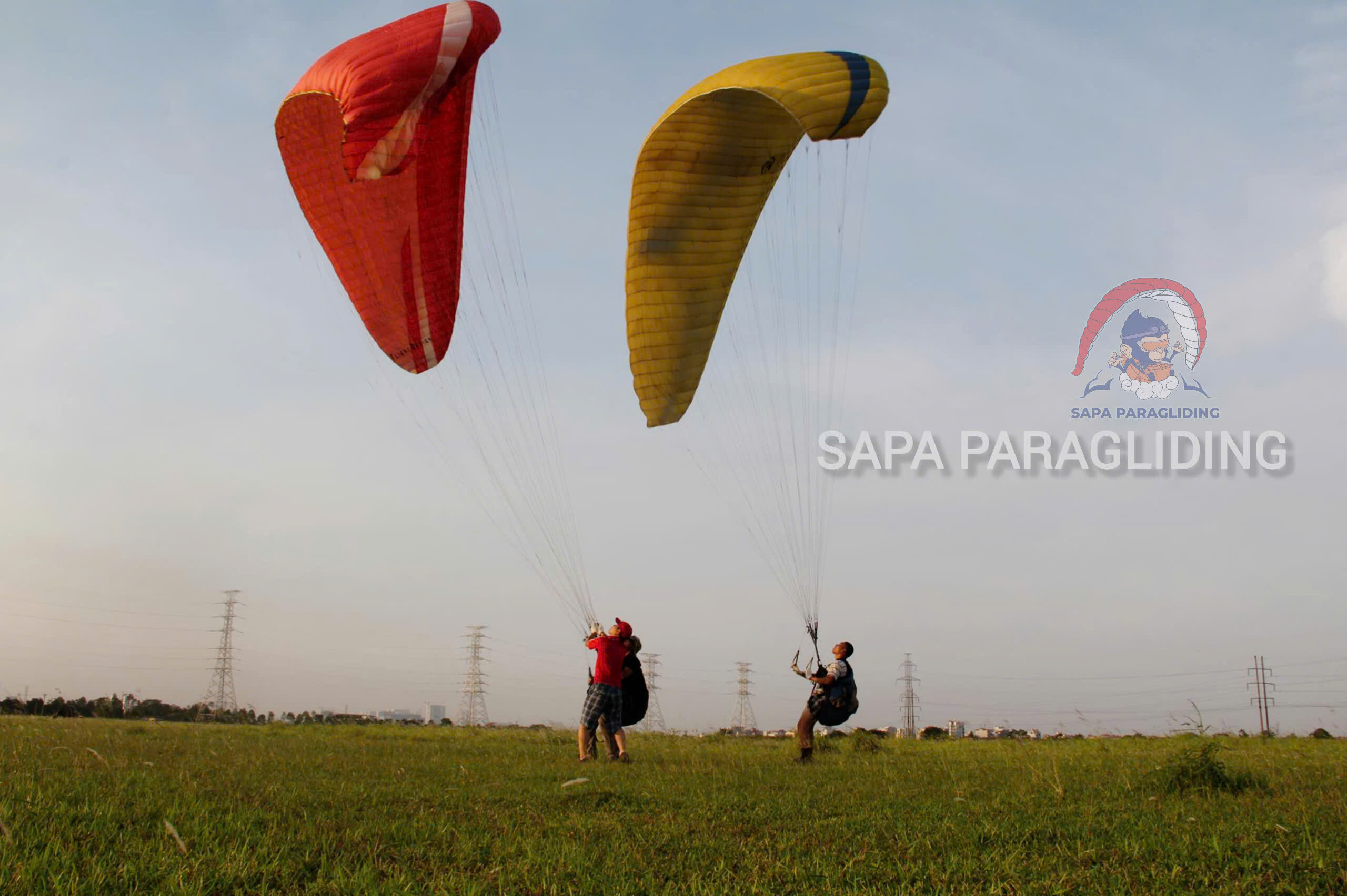 Pilots practising ground handling with their paragliders