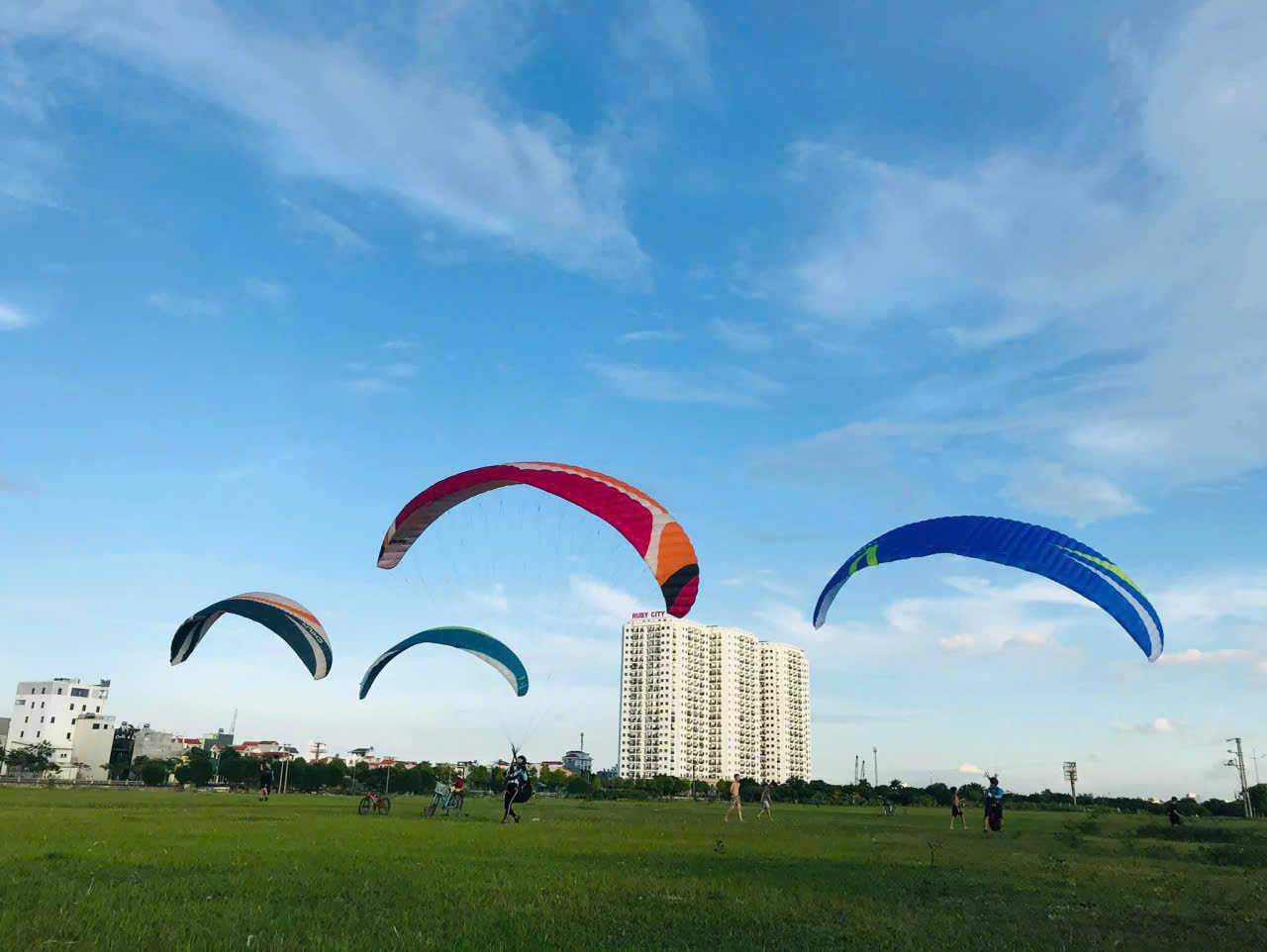 Pilots practising ground handling with their paragliders in Hanoi