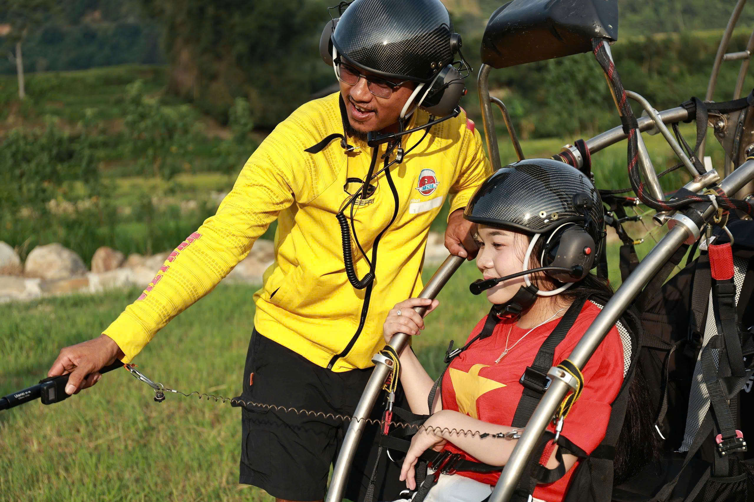A pilot briefing a passenger before take-off