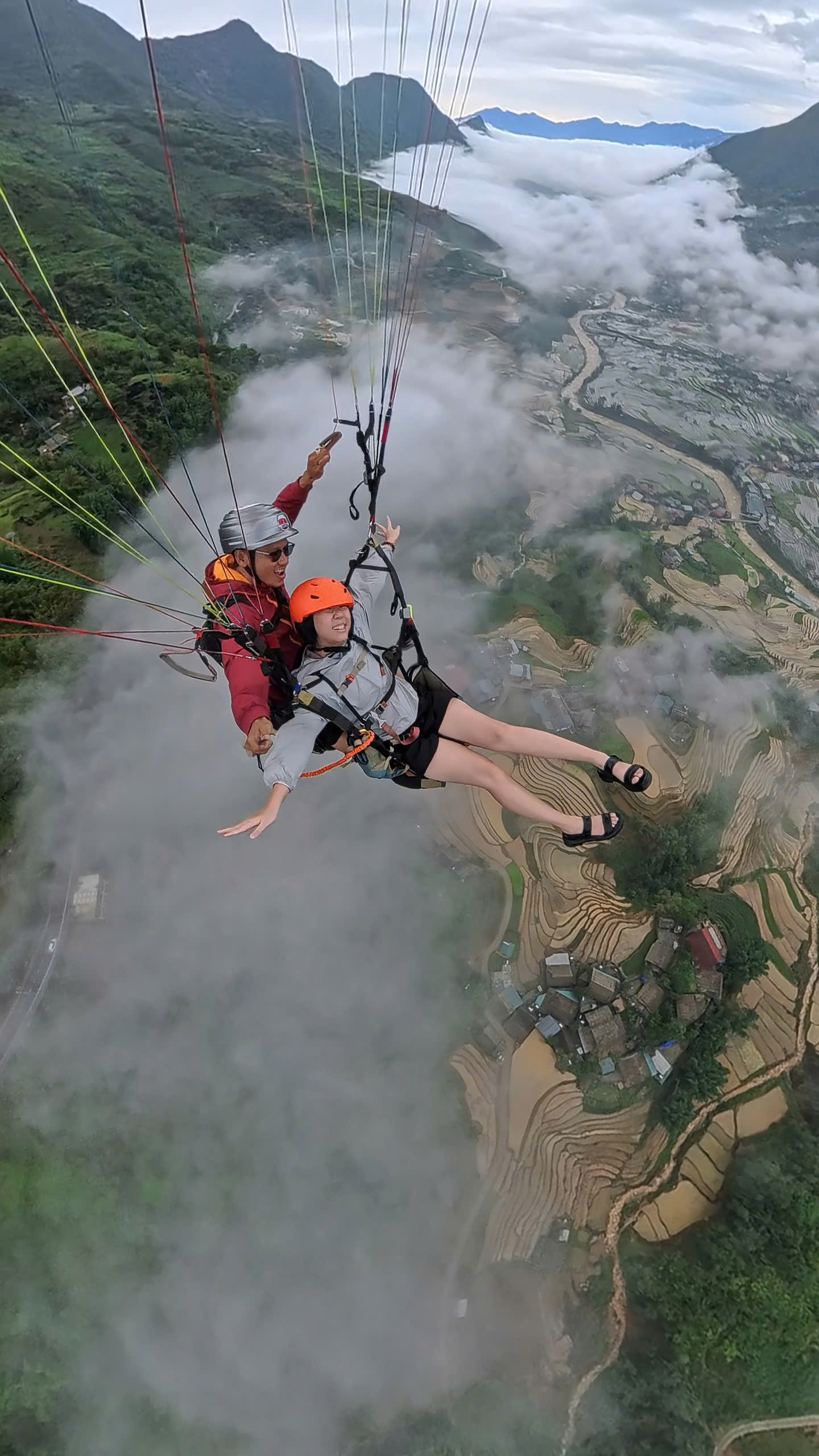 Paragliding above a dreamlike layer of clouds.