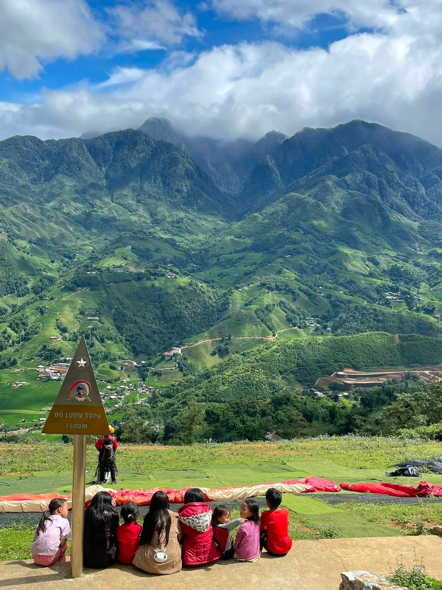 The Sapa launch site with wings laid out and the Hoang Lien Son range behind