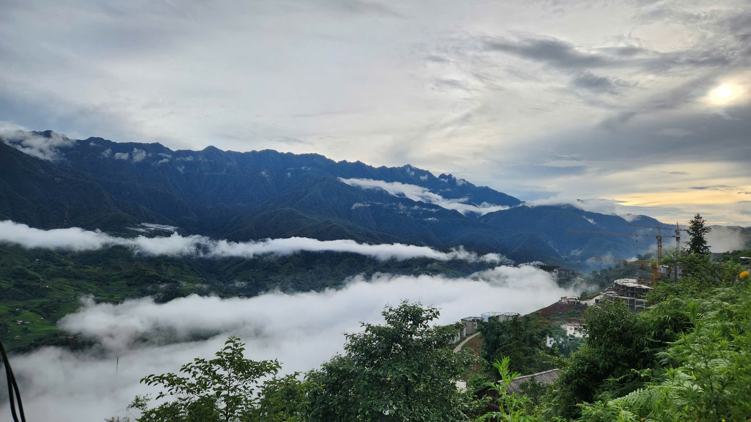 Low cloud filling the valley below Sapa on an early August morning