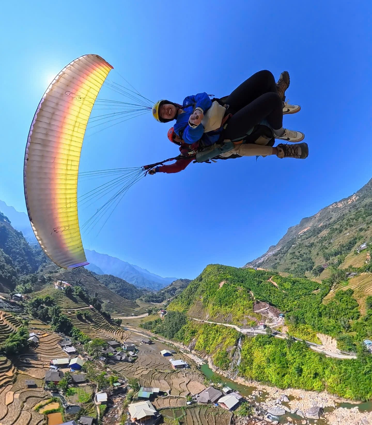 Aerial Acrobatics: Excited tourists screaming while paragliding