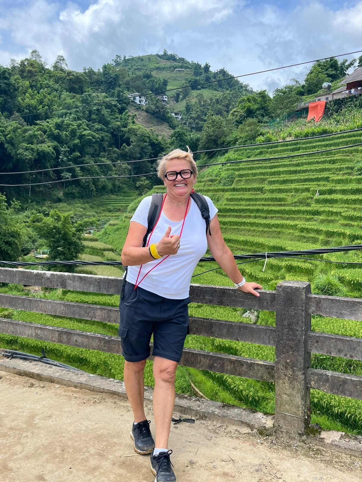 Tourists trekking through Lao Chai Village in Sapa, Vietnam