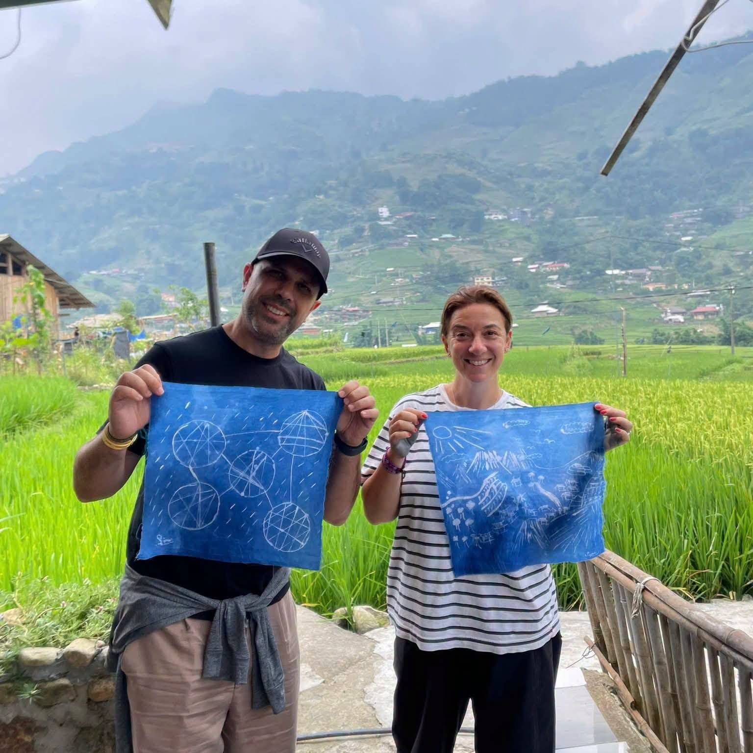 Tourists visiting local traditional textile workshops in Lao Chai Village, Sapa