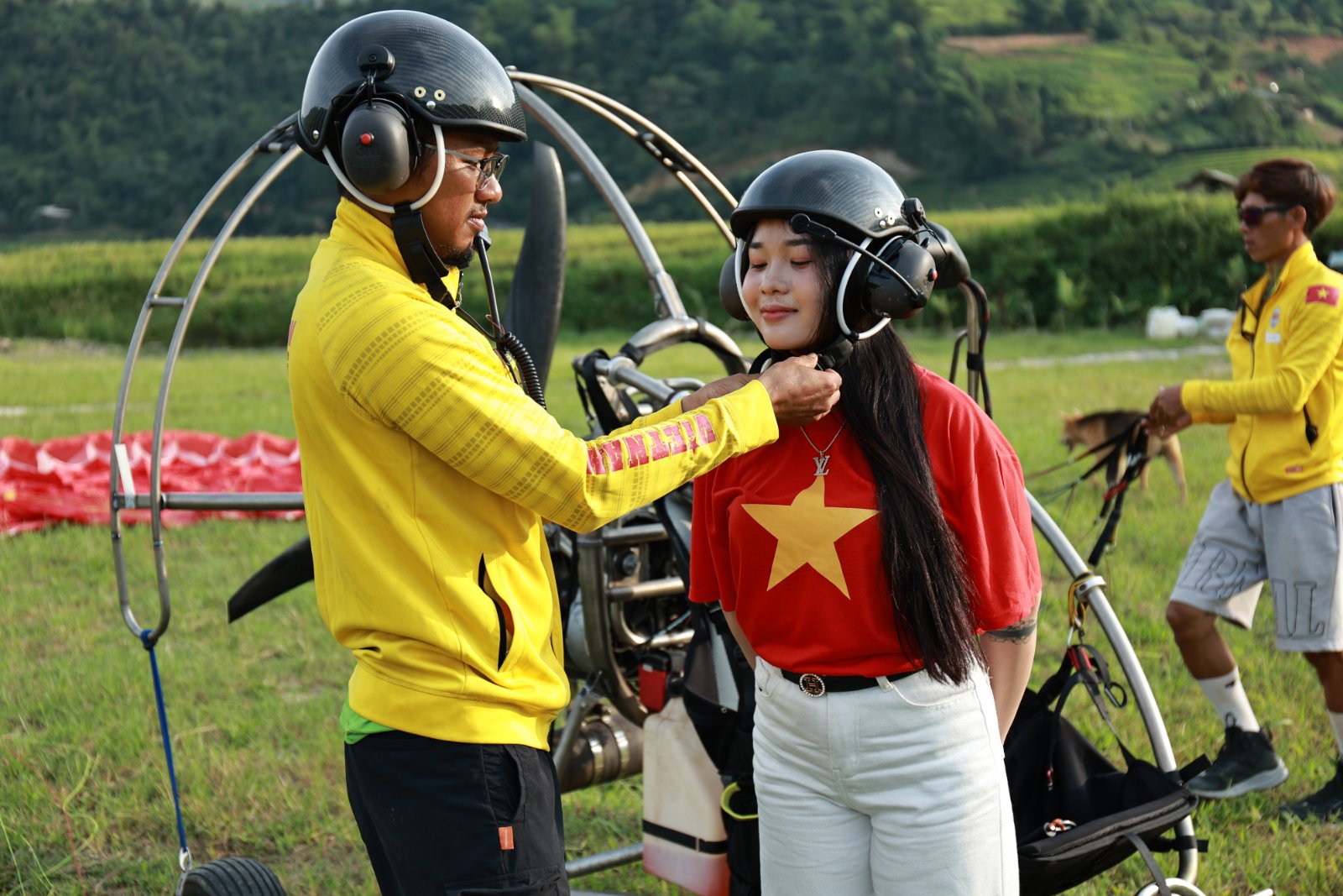 The paramotor helmet with ear defenders and intercom — you can talk to your pilot for the whole flight