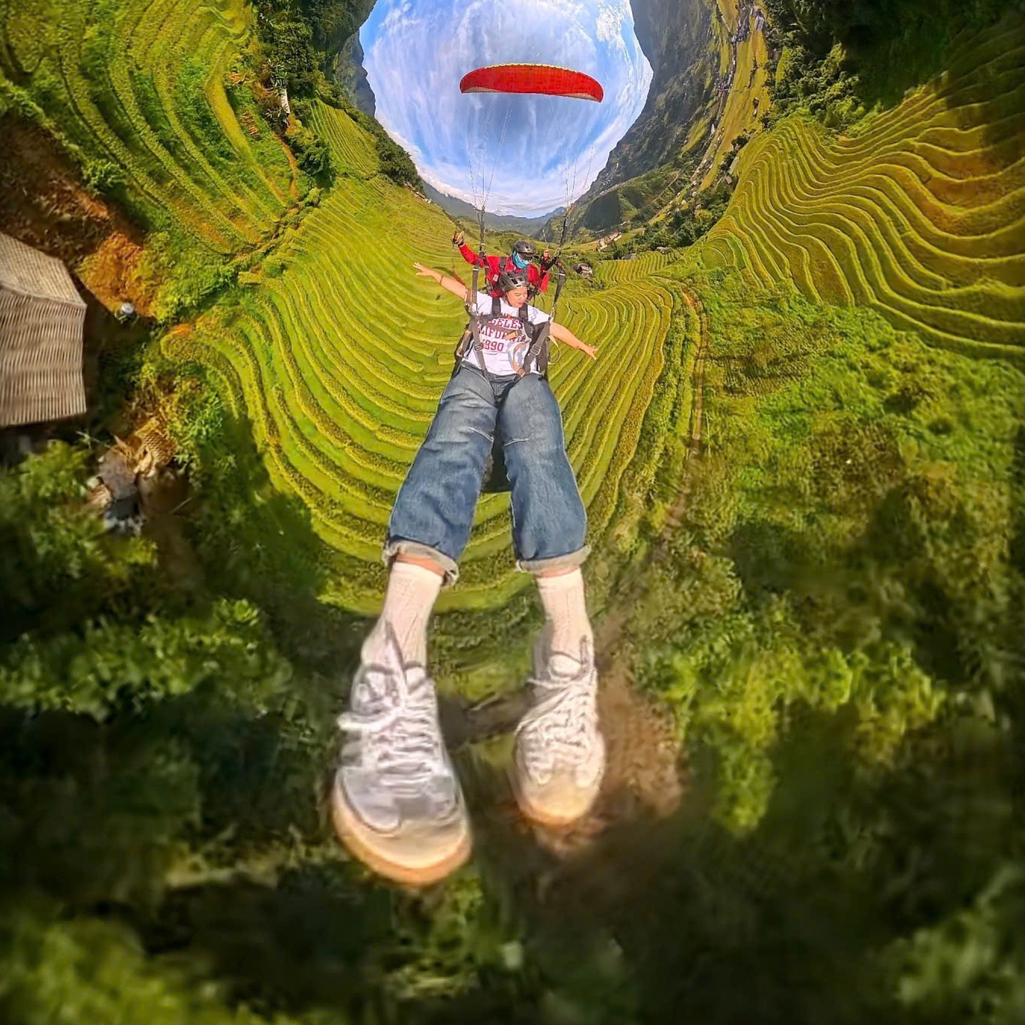 Tiny-planet photo taken during a paragliding flight over the rice terraces of Sa Pa