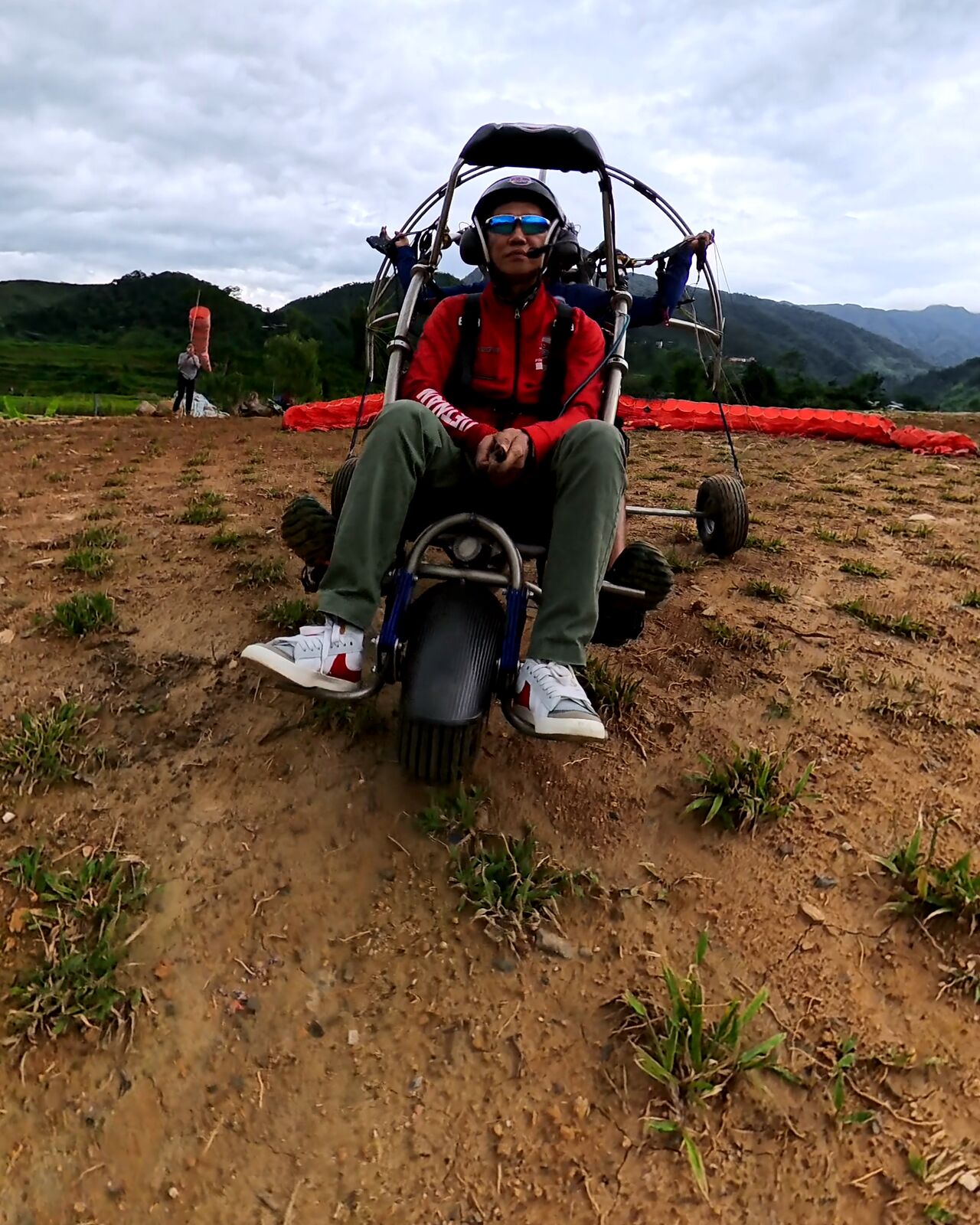 A guest seated on the trike before takeoff: no running launch, no landing on foot