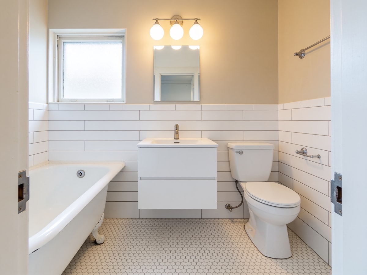 Bathroom refresh in progress — tile and fixture installation