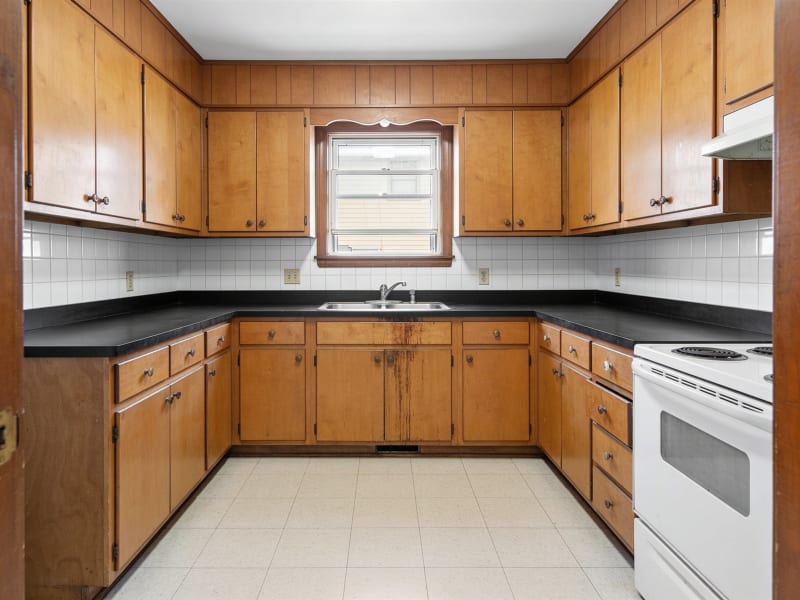 Medford condo kitchen with dated honey-oak cabinet doors before refinishing