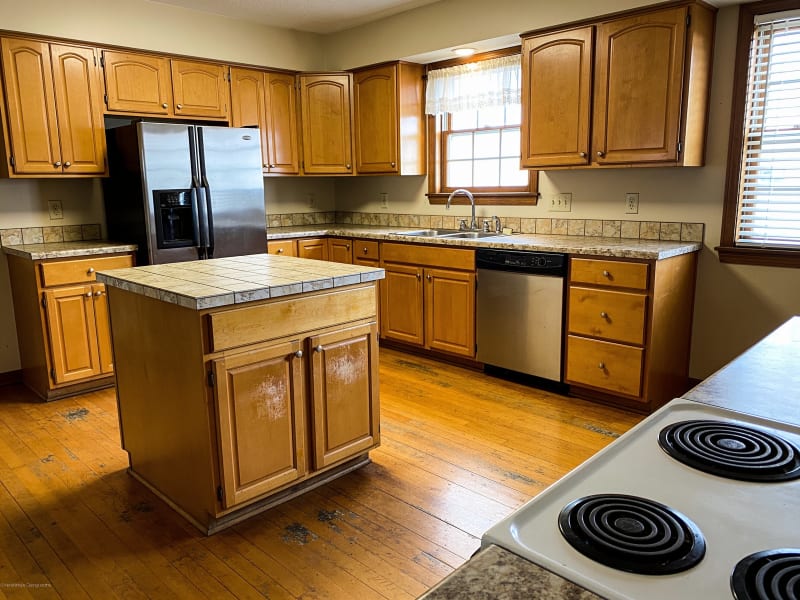 Winchester colonial home kitchen with original 1990s honey-oak cabinet doors before refinishing