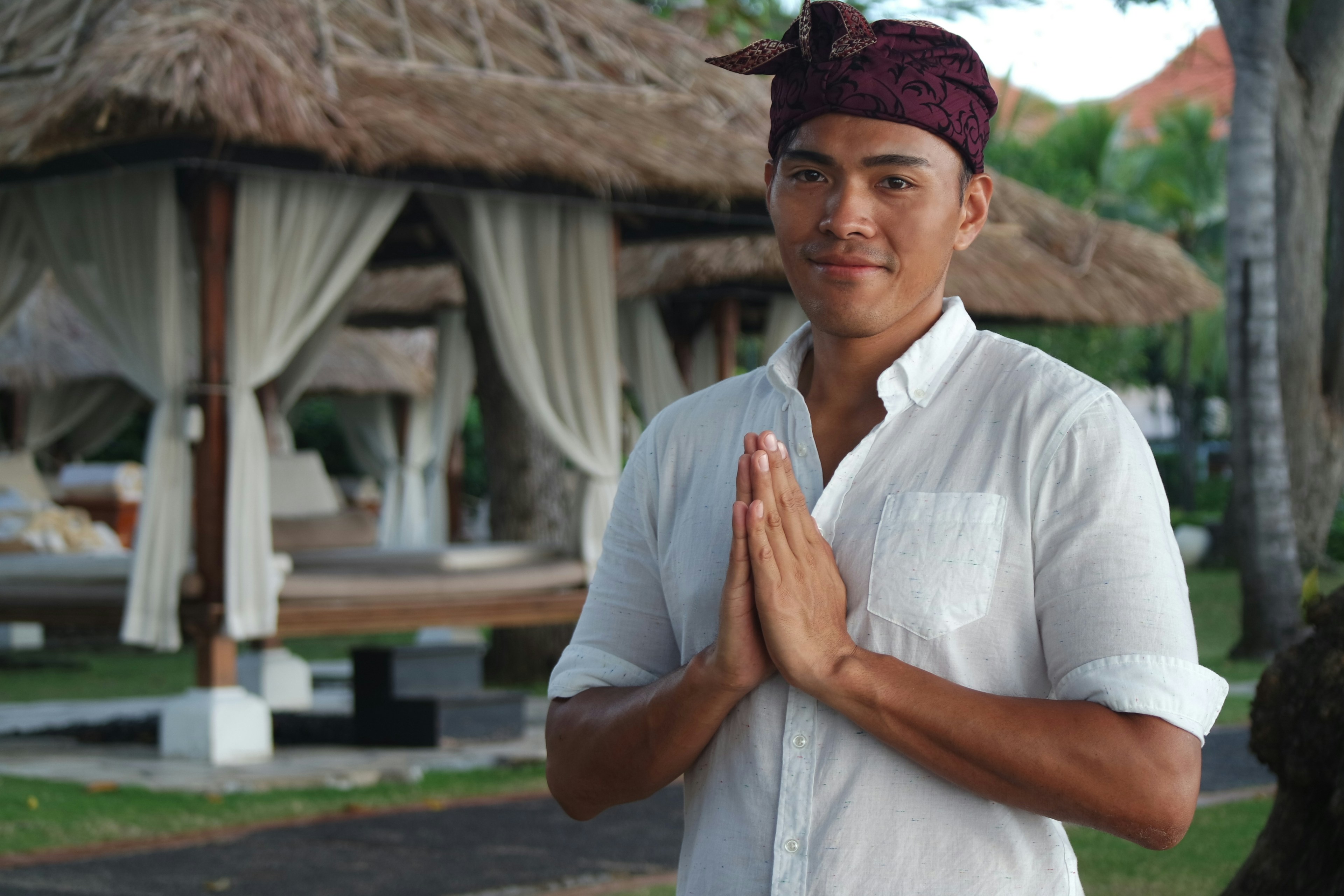 A man in traditional Balinese attire, performing the 