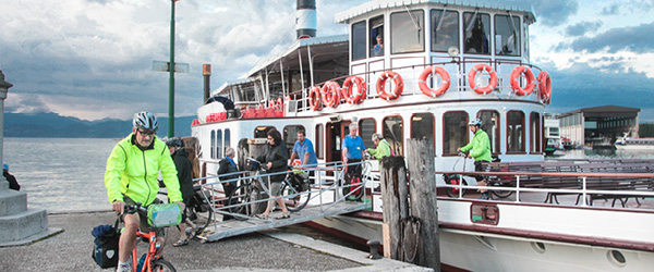 Cycle tourists leave the barge with their bikes and set off on the route, bike and barge tours 