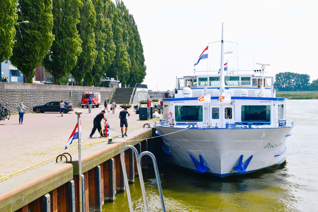 Passengers boarding a river cruise ship in the Netherlands.