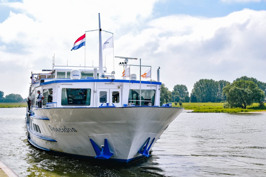 River cruise ship sailing through the canals of the Netherlands.
