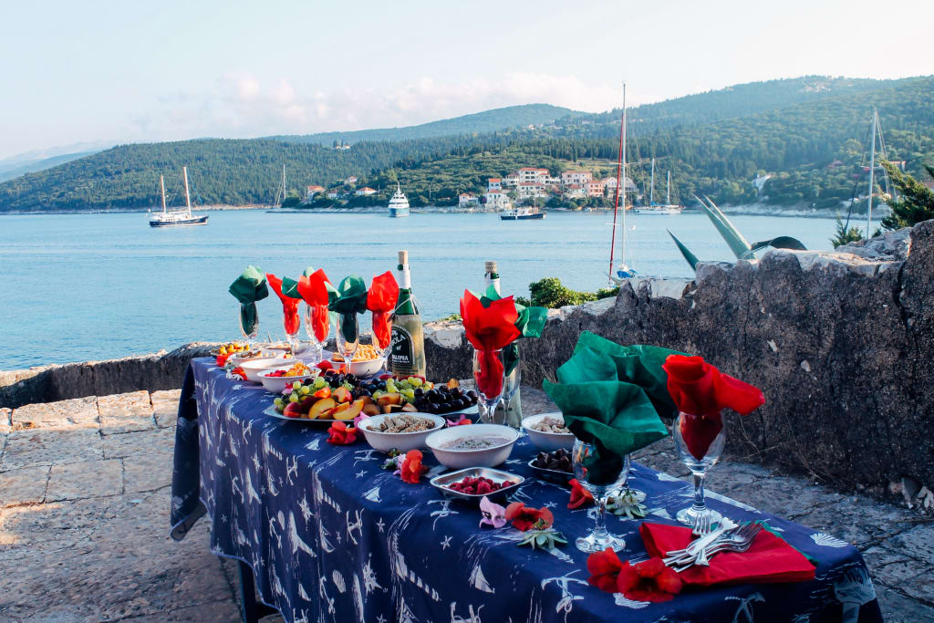 Laid and decorated table along the port, Greece