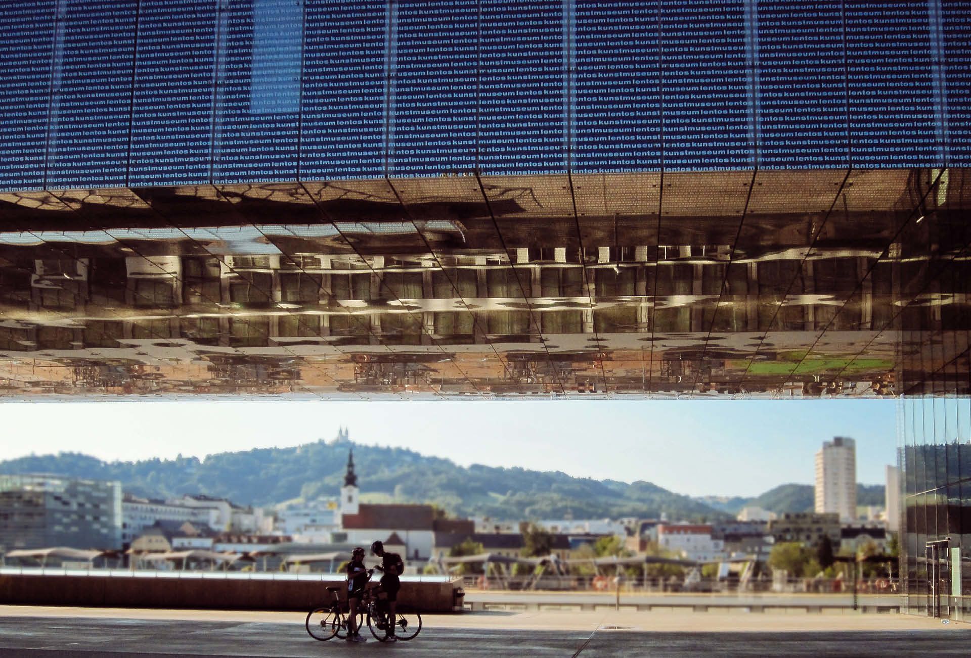 Cyclists stopped at a modern cycle station from Passau to Vienna