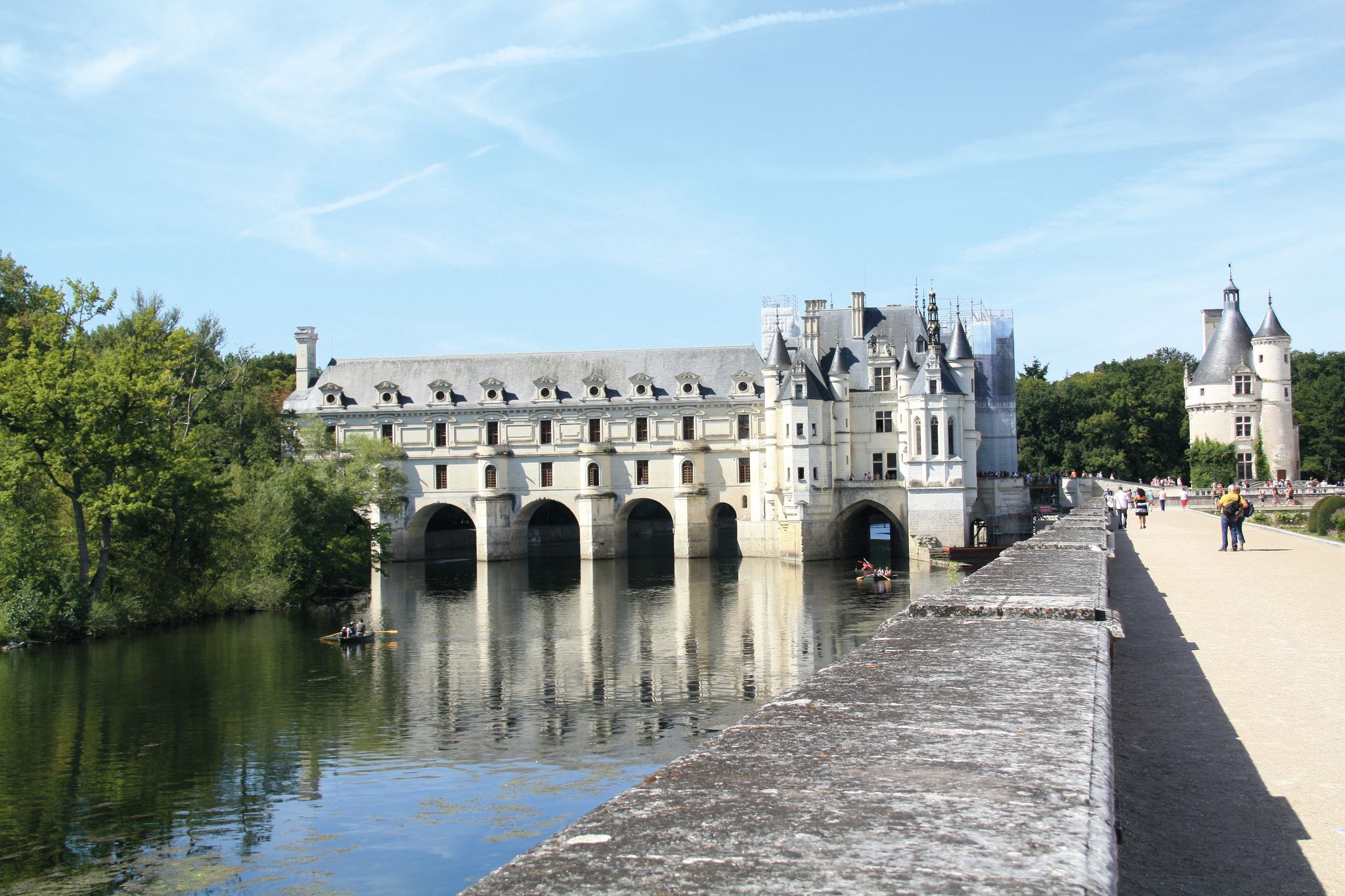 Side view of Chenonceau Castle, with arches over the Cher River, Loire Valley, France.