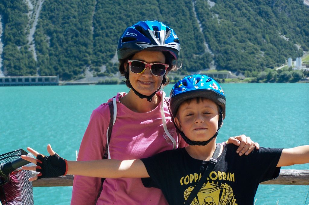 Mother and son biking near Lake Caldaro, Trentino-South Tyrol.