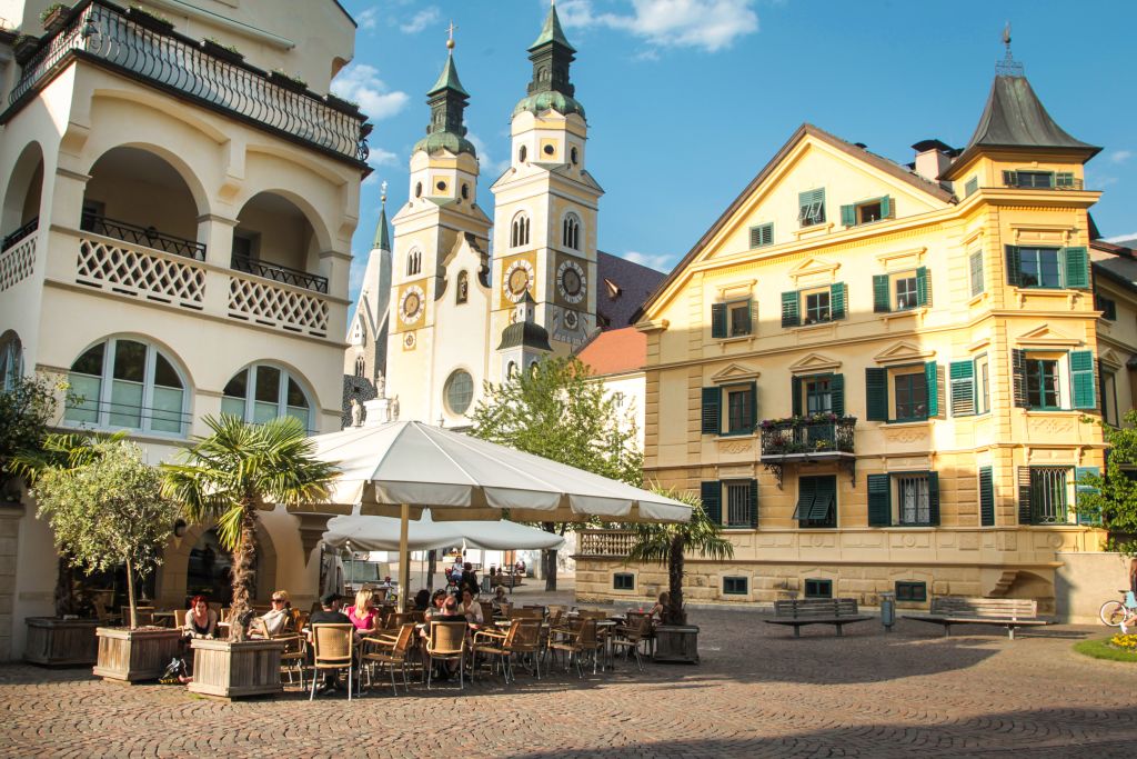 Main square with church and café, Adige cycle path from Brenner
