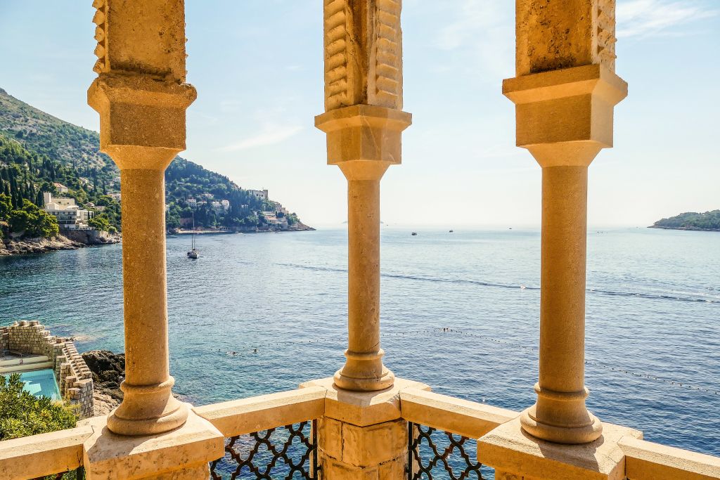 Detail of stone columns overlooking the sea.