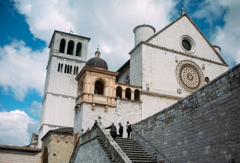 Tower and facade of the Basilica of Saint Francis in Assisi.
