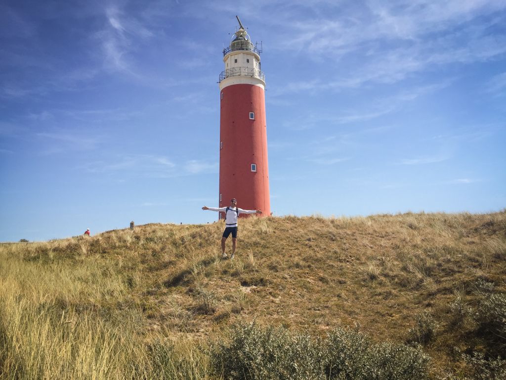 Texel red lighthouse on a grassy hill, Frisian Islands