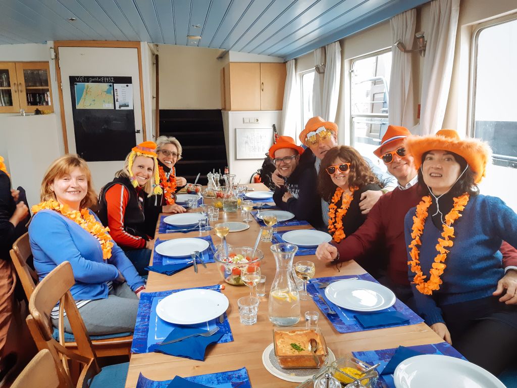 Group of people dining together in a local restaurant, Netherlands.