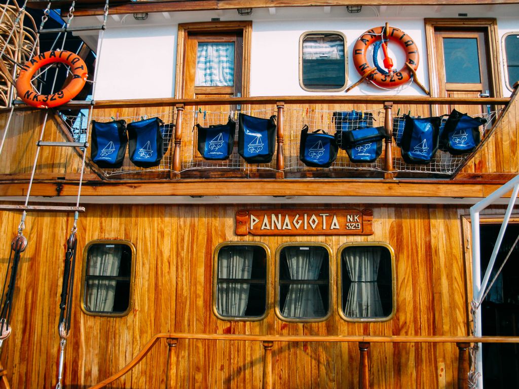Detail of the facade of a traditional boat in the harbor of Parga, Greece.
