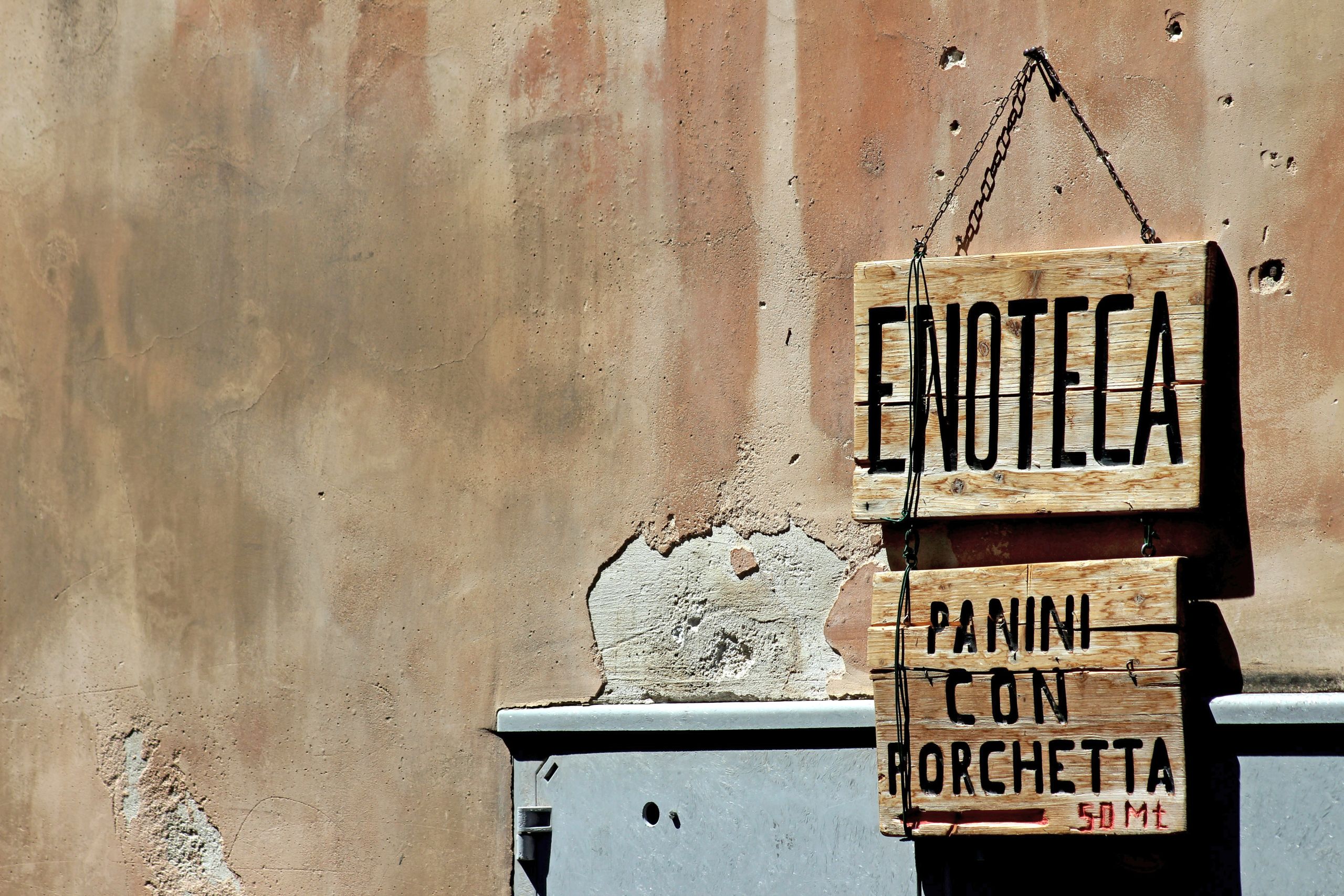Rustic sign of a sandwich shop in Rome’s historic center.