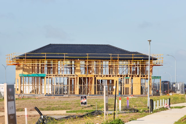 House being framed by a construction crew
